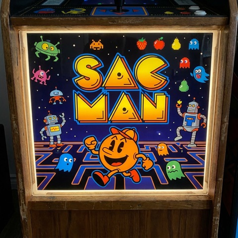 Parody marquee art from the game build — Sac Man