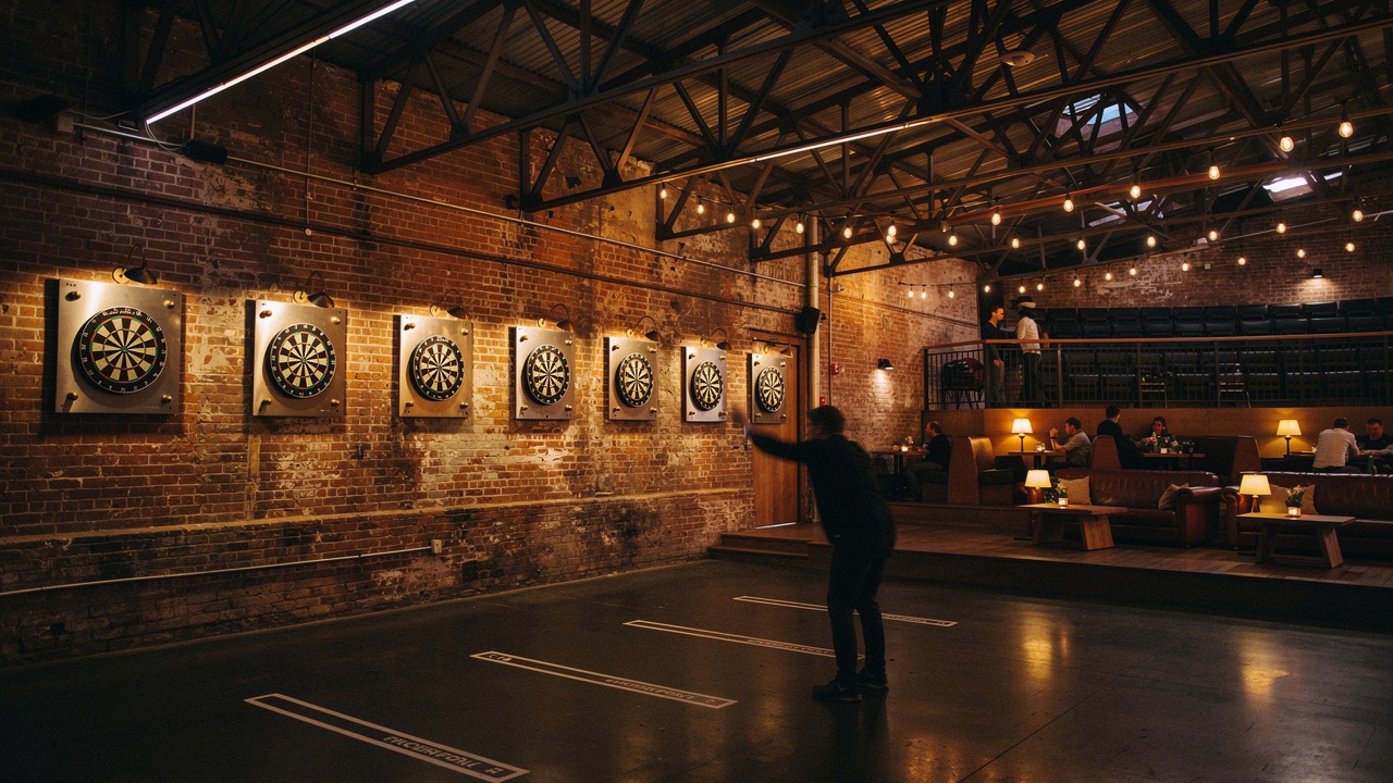 Concept render — target darts rank on the brick wall with brass scoring lights
